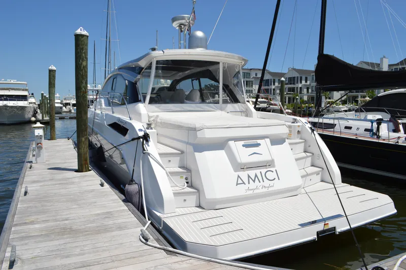 Amici Yacht Photos Pics 2019 Azimut Atlantis 51 yacht docked at marina, showcasing sleek design and luxury features.