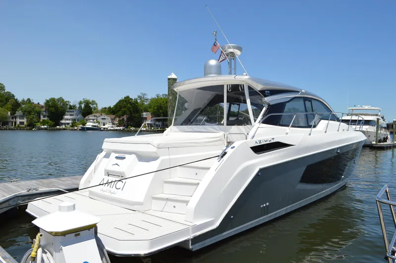 Amici Yacht Photos Pics 2019 Azimut Atlantis 51 yacht docked on a sunny day, showcasing sleek design and luxury.