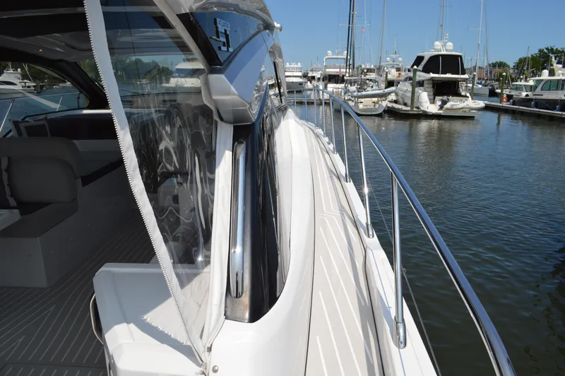 Amici Yacht Photos Pics 2019 Azimut Atlantis 51 yacht docked in marina, showcasing sleek design and luxurious features.