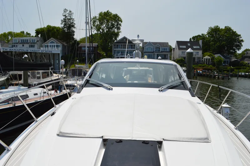 Amici Yacht Photos Pics 2019 Azimut Atlantis 51 yacht docked near waterfront homes.