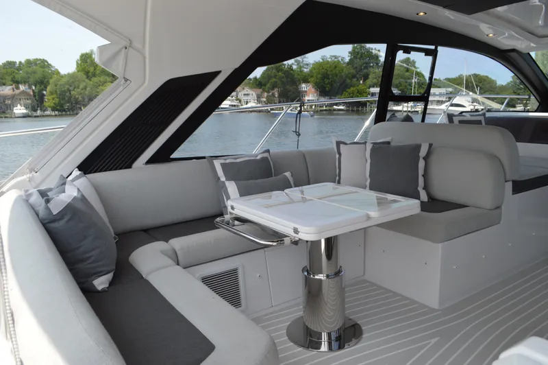 Amici Yacht Photos Pics Luxurious 2019 Azimut Atlantis 51 yacht interior with elegant seating and table.