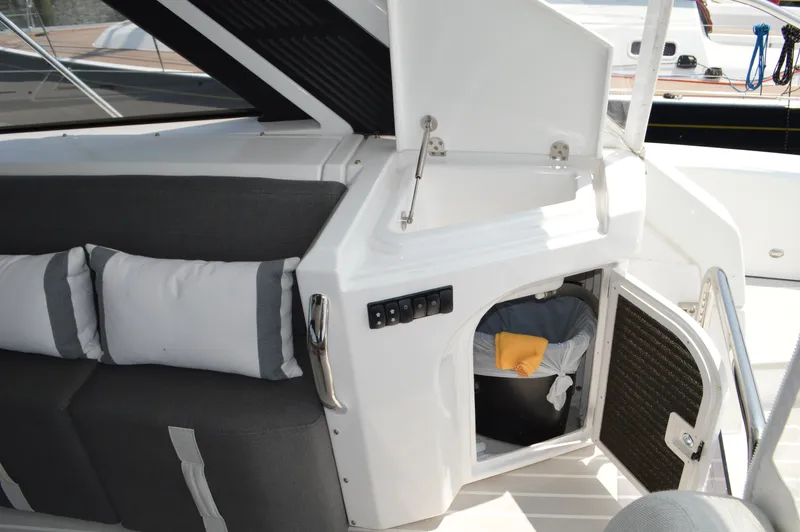 Amici Yacht Photos Pics 2019 Azimut Atlantis 51 yacht interior with cushioned seating and storage compartment.