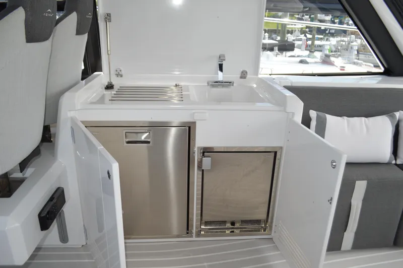 Amici Yacht Photos Pics 2019 Azimut Atlantis 51 yacht interior with kitchenette and seating area.