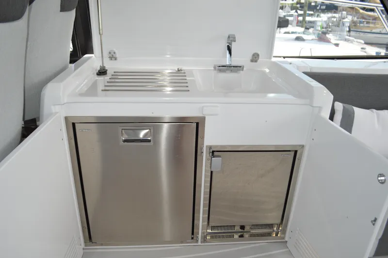 Amici Yacht Photos Pics 2019 Azimut Atlantis 51 yacht kitchenette with stainless steel appliances and sink.