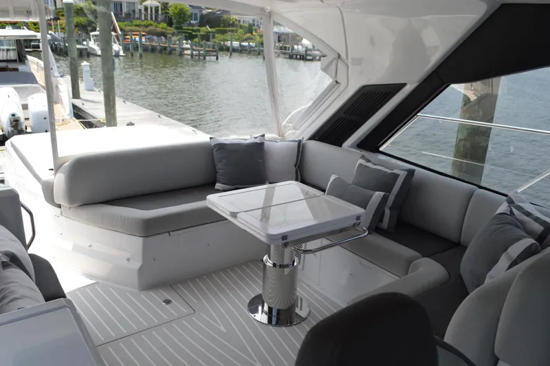 Amici Yacht Photos Pics Luxurious seating area on 2019 Azimut Atlantis 51 yacht, featuring elegant design and waterfront view.