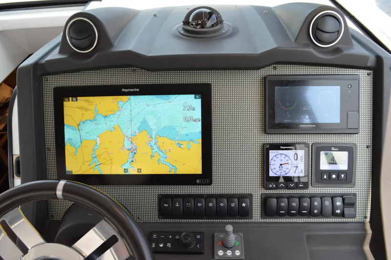 Amici Yacht Photos Pics Control panel of 2019 Azimut Atlantis 51 yacht with navigation and monitoring displays.