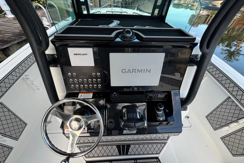  Yacht Photos Pics Center console of 2021 Wellcraft 302 Fisherman with Garmin and Mercury controls.