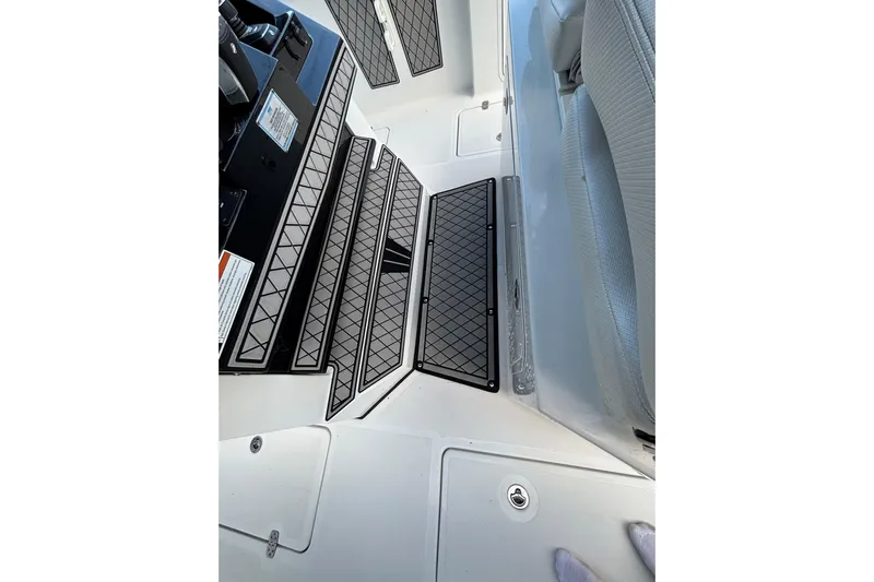  Yacht Photos Pics 2021 Wellcraft 302 Fisherman boat interior with non-slip flooring and seating.