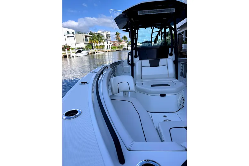  Yacht Photos Pics 2021 Wellcraft 302 Scarab boat interior with sleek seating and waterfront view.