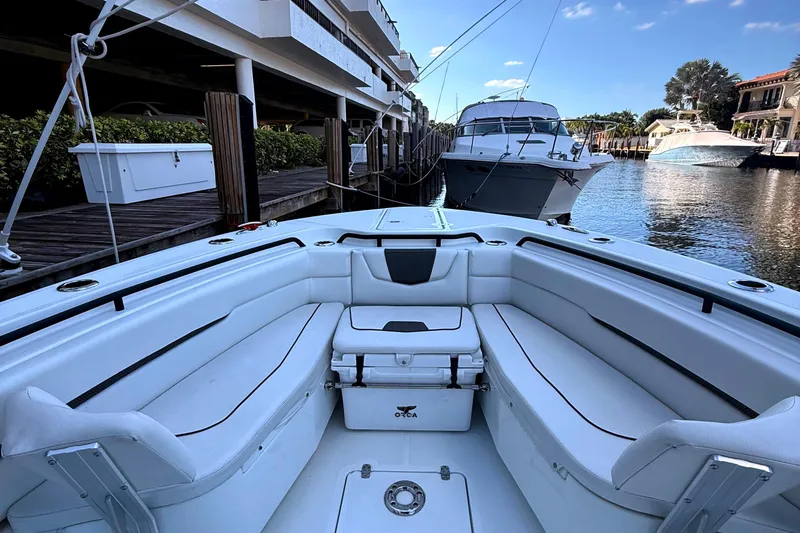  Yacht Photos Pics 2021 Wellcraft 302 Scarab boat docked, featuring spacious seating and sleek design.