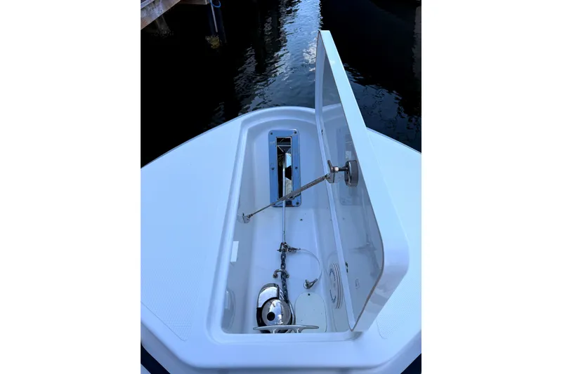  Yacht Photos Pics 2021 Wellcraft 302 Scarab anchor compartment with open hatch, dockside view.