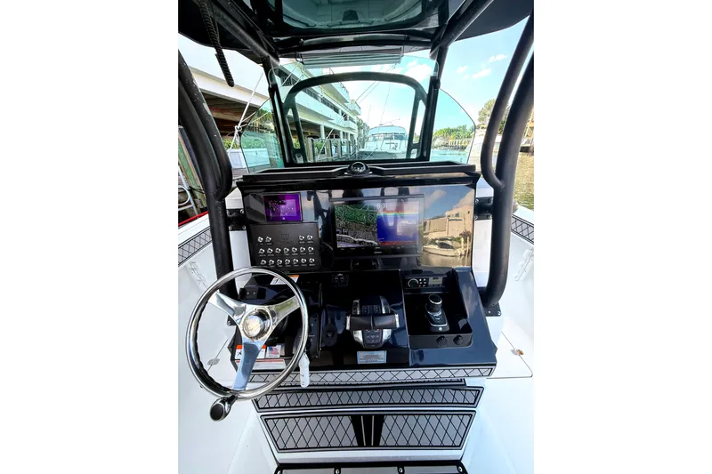  Yacht Photos Pics 2021 Wellcraft 302 Scarab helm with modern navigation and control systems.