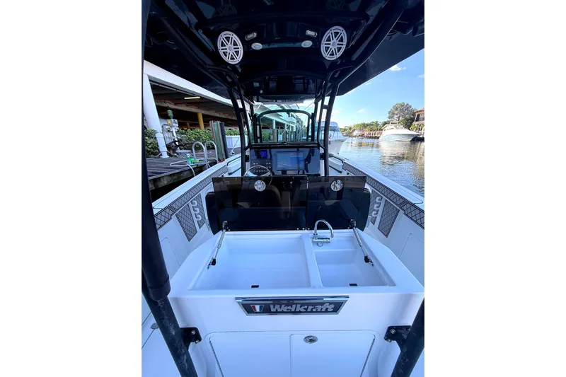  Yacht Photos Pics 2021 Wellcraft 302 Scarab boat interior with dual sinks and modern dashboard.