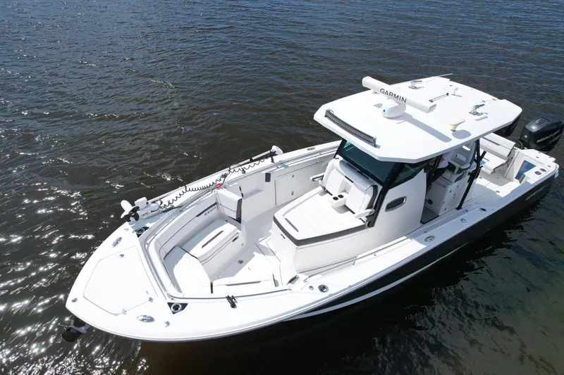  Yacht Photos Pics 2021 Blackfin 332 CC boat on water, featuring sleek design and advanced navigation equipment.