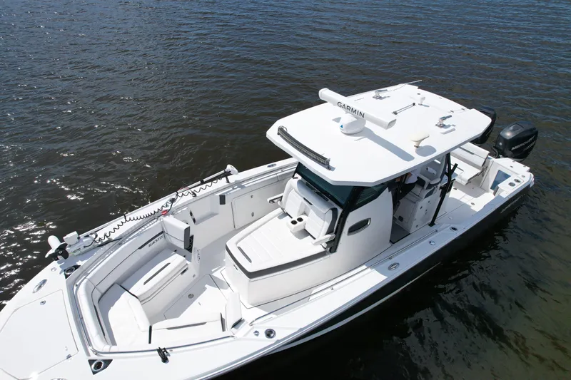  Yacht Photos Pics 2021 Blackfin 332 CC boat on water, featuring sleek design and advanced navigation equipment.