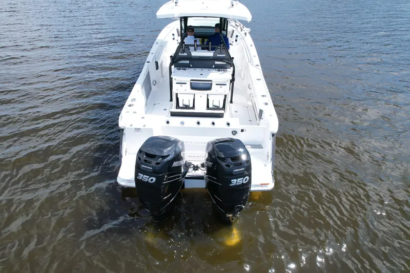  Yacht Photos Pics 2021 Blackfin 332 CC boat with dual 350 horsepower engines on water.