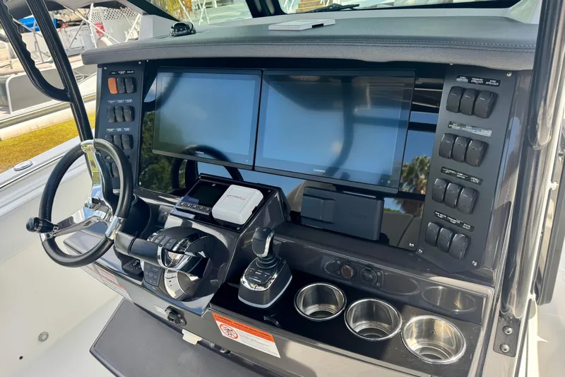  Yacht Photos Pics 2021 Blackfin 332 CC boat dashboard with dual screens and control panel.