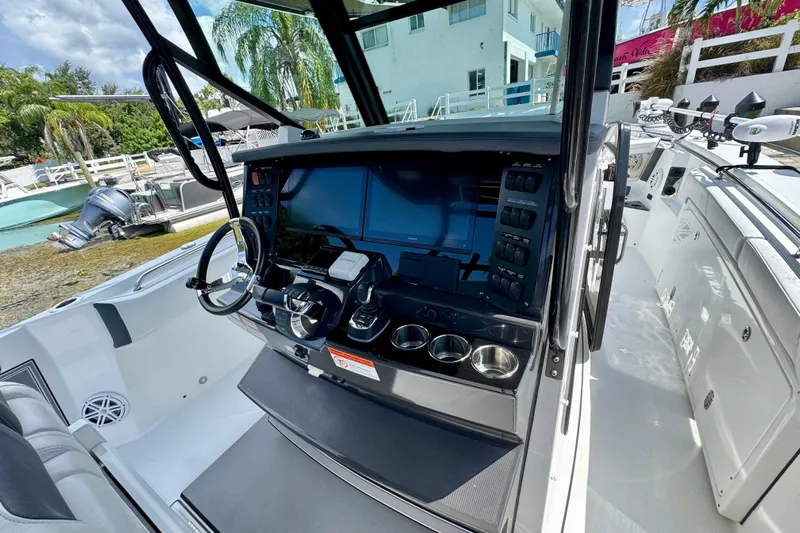  Yacht Photos Pics 2021 Blackfin 332 CC boat cockpit with modern controls and steering wheel.