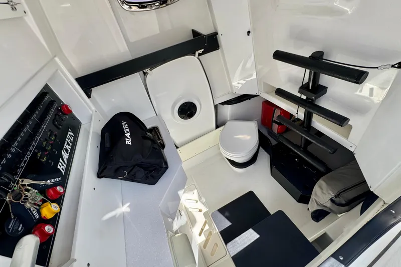  Yacht Photos Pics Interior of 2021 Blackfin 332 CC boat featuring a compact cabin with seating and storage.