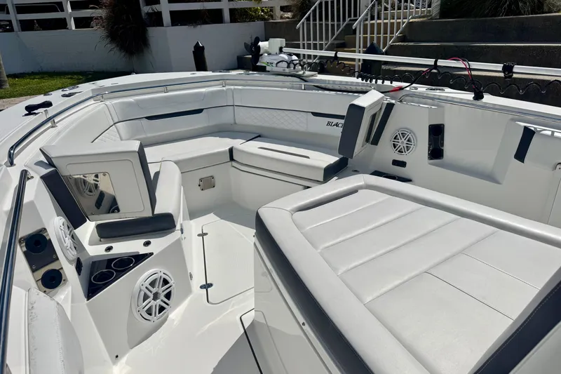  Yacht Photos Pics 2021 Blackfin 332 CC boat interior with white seating and modern design.