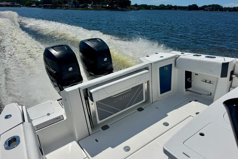  Yacht Photos Pics 2021 Blackfin 332 CC boat with dual Mercury engines cruising on a lake.