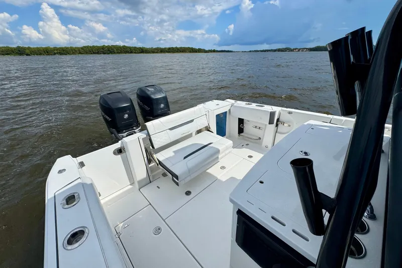  Yacht Photos Pics 2021 Blackfin 332 CC boat with dual Mercury engines on a calm lake.