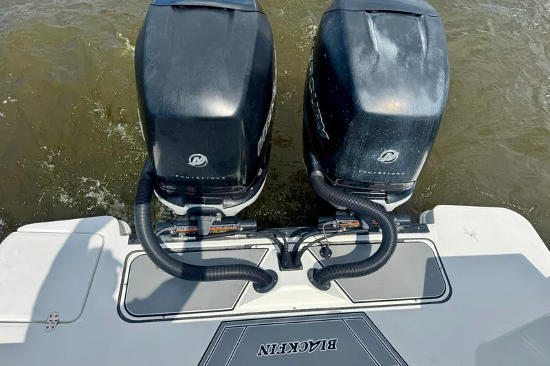  Yacht Photos Pics 2021 Blackfin 332 CC boat with dual outboard motors on water.