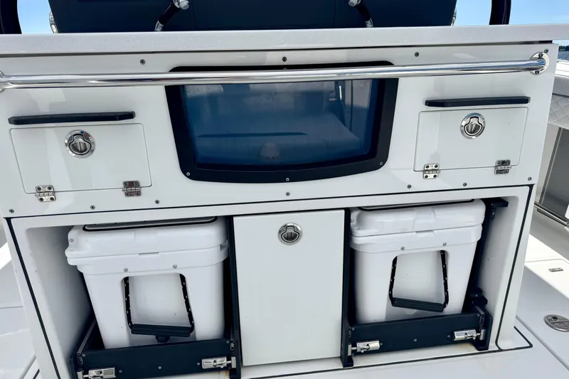 Yacht Photos Pics 2021 Blackfin 332 CC boat console with storage compartments and coolers.