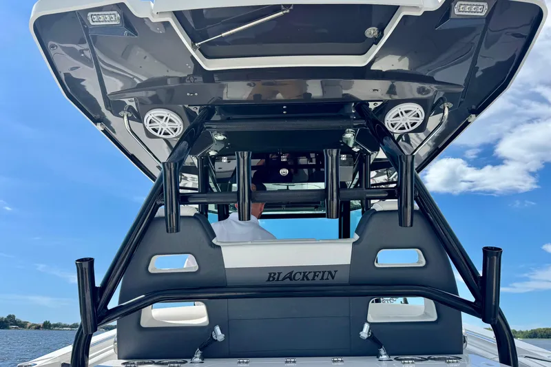  Yacht Photos Pics 2021 Blackfin 332 CC boat with sleek design and modern features on a sunny day.