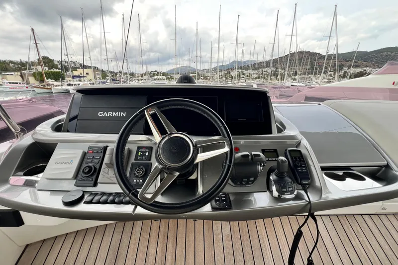  Yacht Photos Pics Helm of 2021 Princess F55 yacht with Garmin navigation system, docked in marina.