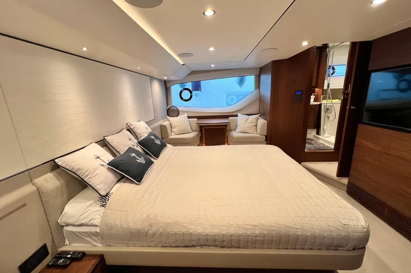  Yacht Photos Pics Luxurious 2021 Princess F55 yacht bedroom with elegant decor and modern amenities.