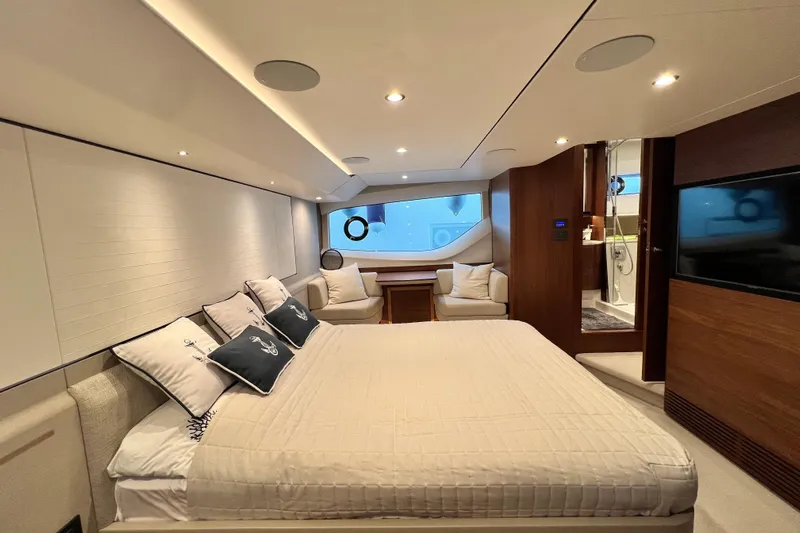  Yacht Photos Pics Luxurious 2021 Princess F55 yacht bedroom with elegant decor and modern amenities.
