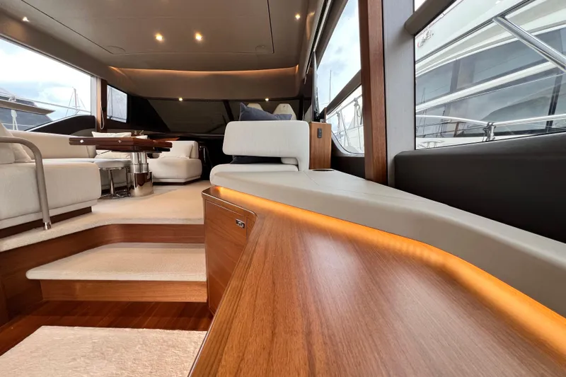  Yacht Photos Pics Luxurious interior of 2021 Princess F55 yacht with elegant seating and ambient lighting.