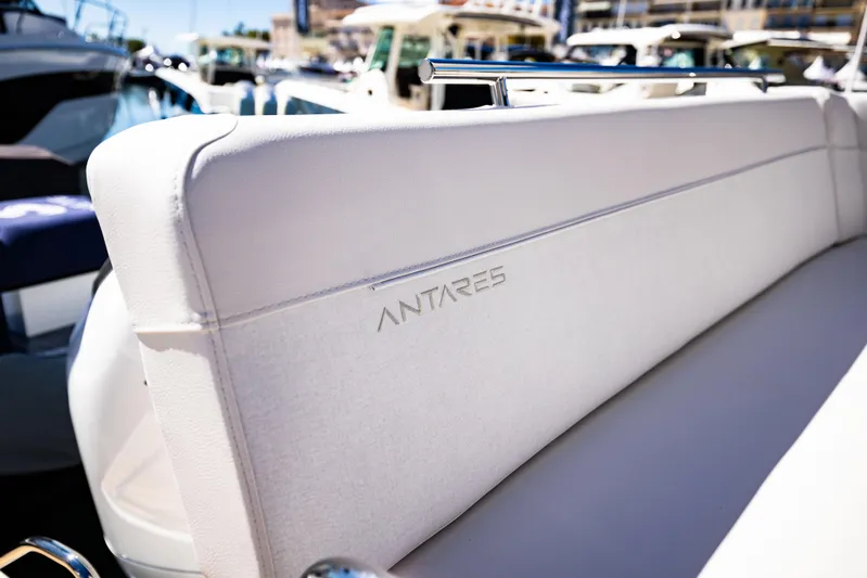  Yacht Photos Pics 2026 Beneteau Antares 11 boat seat with embossed logo, docked in marina.