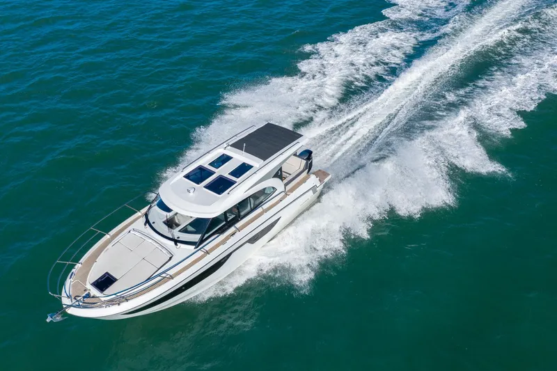  Yacht Photos Pics 2026 Beneteau Antares 11 cruising on open water, aerial view.