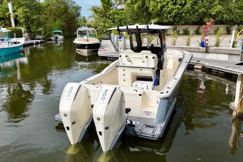  Yacht Photos Pics 2026 Scout 288 LXF boat docked with twin Mercury 300 V8 engines.