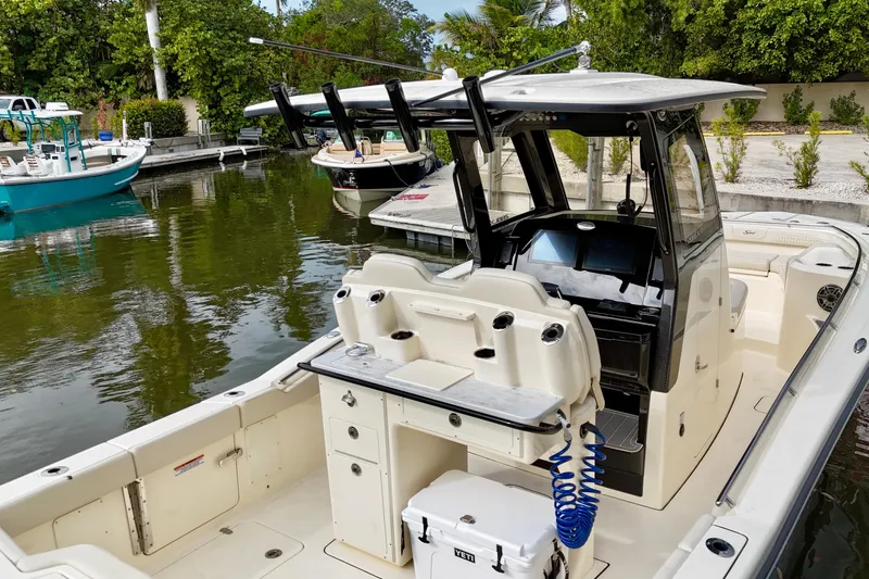  Yacht Photos Pics 2026 Scout 288 LXF boat docked, featuring a sleek design and modern amenities.