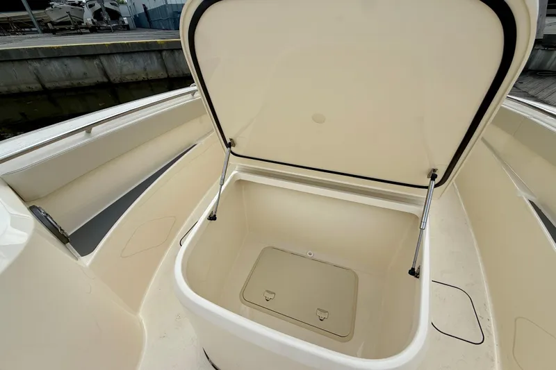  Yacht Photos Pics Open storage compartment on 2026 Scout 288 LXF boat, showcasing spacious interior design.
