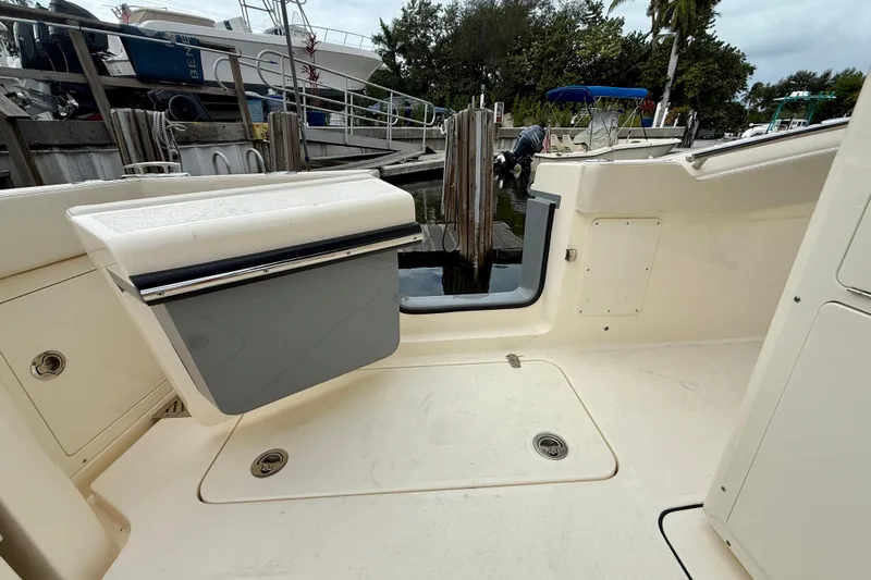  Yacht Photos Pics 2026 Scout 288 LXF boat interior with open hatch, docked at marina.