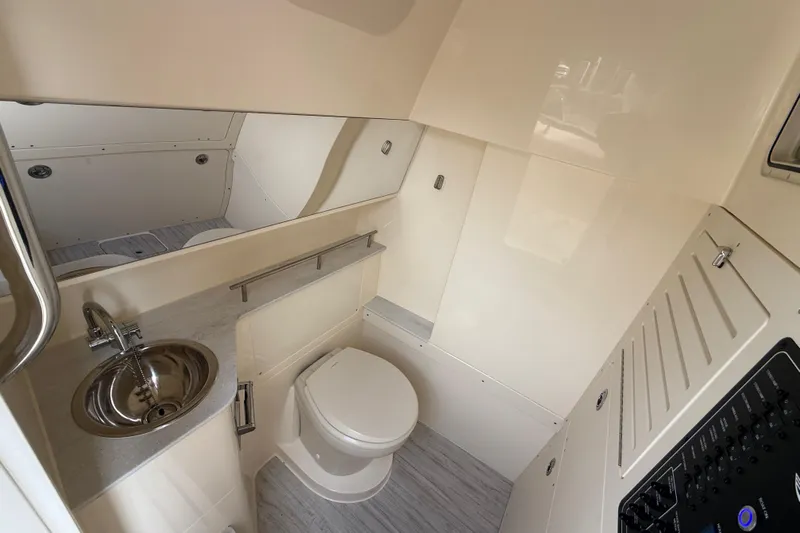  Yacht Photos Pics 2026 Scout 288 LXF boat interior bathroom with modern fixtures and sleek design.