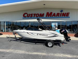 2019 Caravelle 19 EBo Bowrider boat on trailer outside Custom Marine dealership.