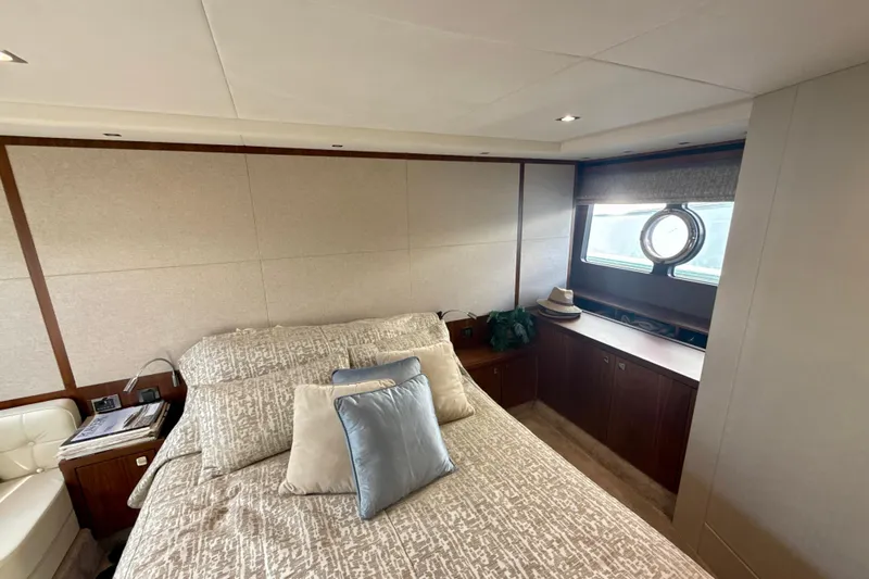 Wine Tyme Yacht Photos Pics Luxurious bedroom interior of 2016 Sunseeker Predator 57 yacht with elegant decor.