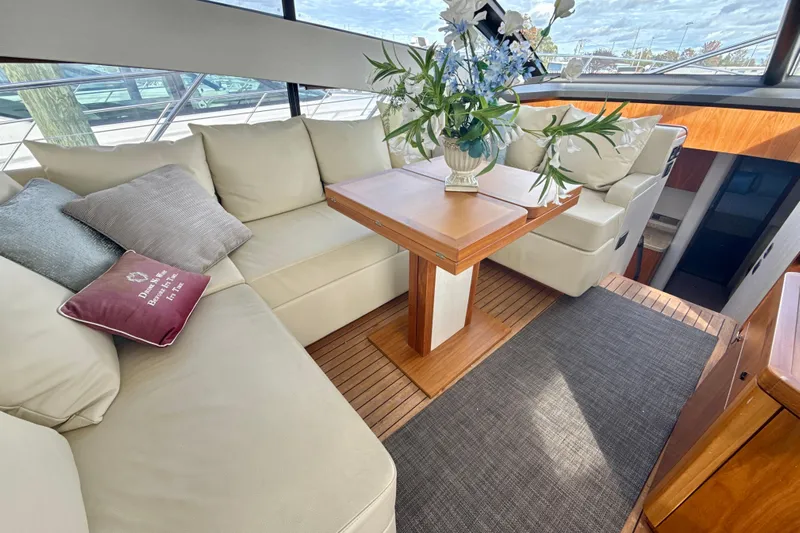 Wine Tyme Yacht Photos Pics Luxurious interior of 2016 Sunseeker Predator 57 yacht with elegant seating and decor.