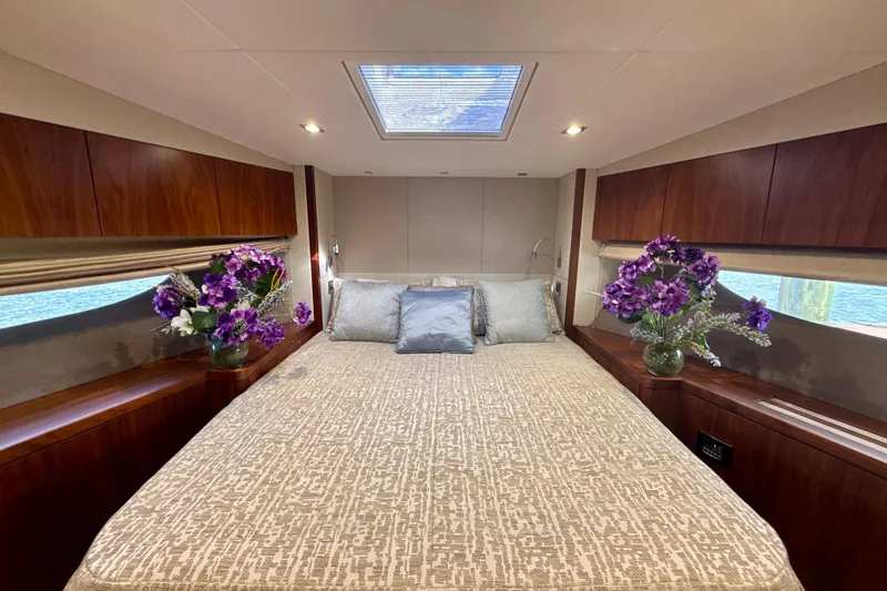 Wine Tyme Yacht Photos Pics Luxurious 2016 Sunseeker Predator 57 yacht bedroom with elegant decor and floral arrangements.