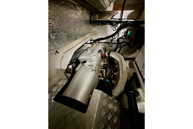 Wine Tyme Yacht Photos Pics Engine room of 2016 Sunseeker Predator 57 yacht, showcasing mechanical components and wiring.