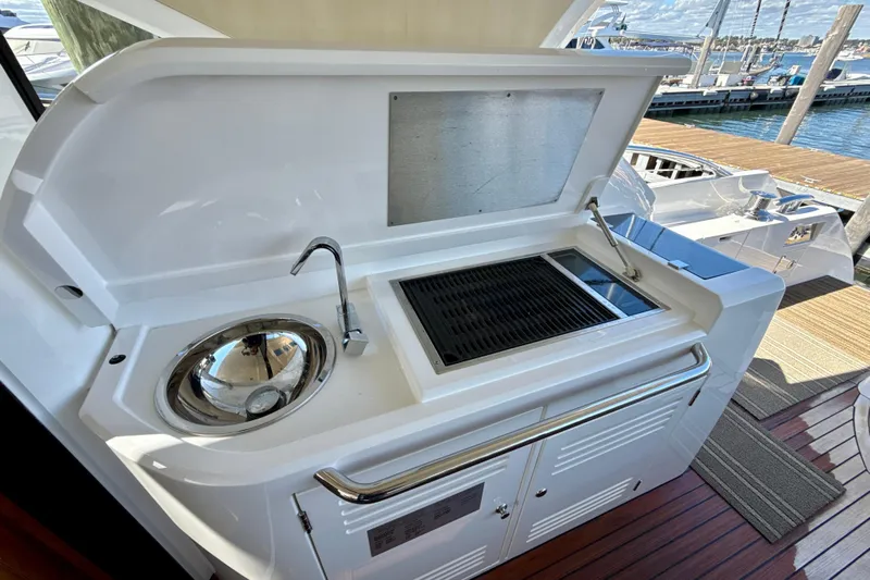 Wine Tyme Yacht Photos Pics Outdoor kitchen on 2016 Sunseeker Predator 57 yacht with sink and grill.