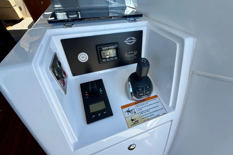 Wine Tyme Yacht Photos Pics Control panel of a 2016 Sunseeker Predator 57 yacht with joystick and display.