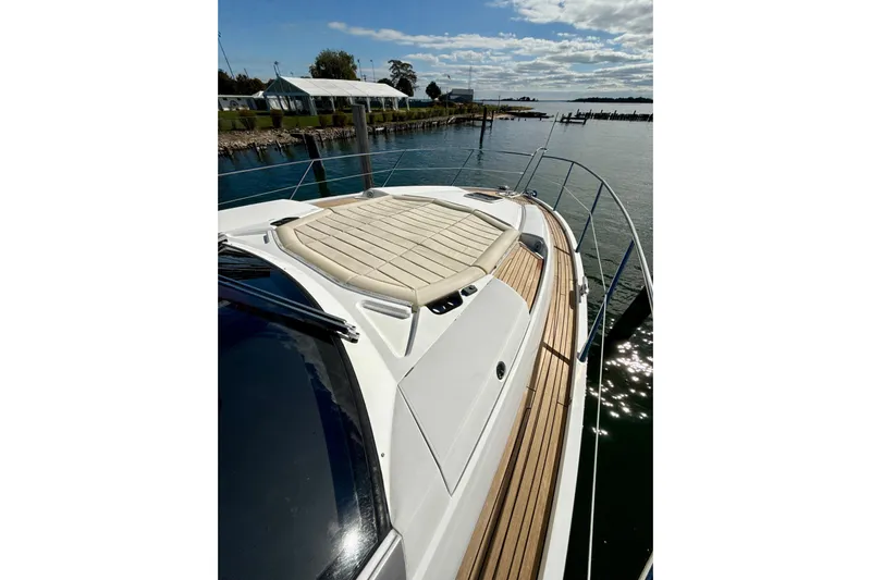 Wine Tyme Yacht Photos Pics Sunseeker Predator 57 yacht, 2016 model, docked with sun pad and wooden deck.