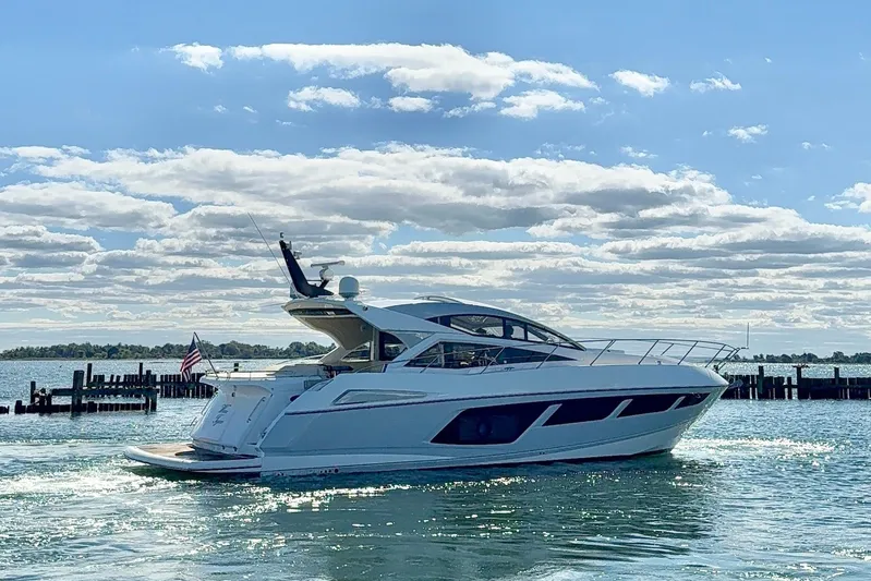 Wine Tyme Yacht Photos Pics 2016 Sunseeker Predator 57 yacht cruising on a sunny day with blue skies.