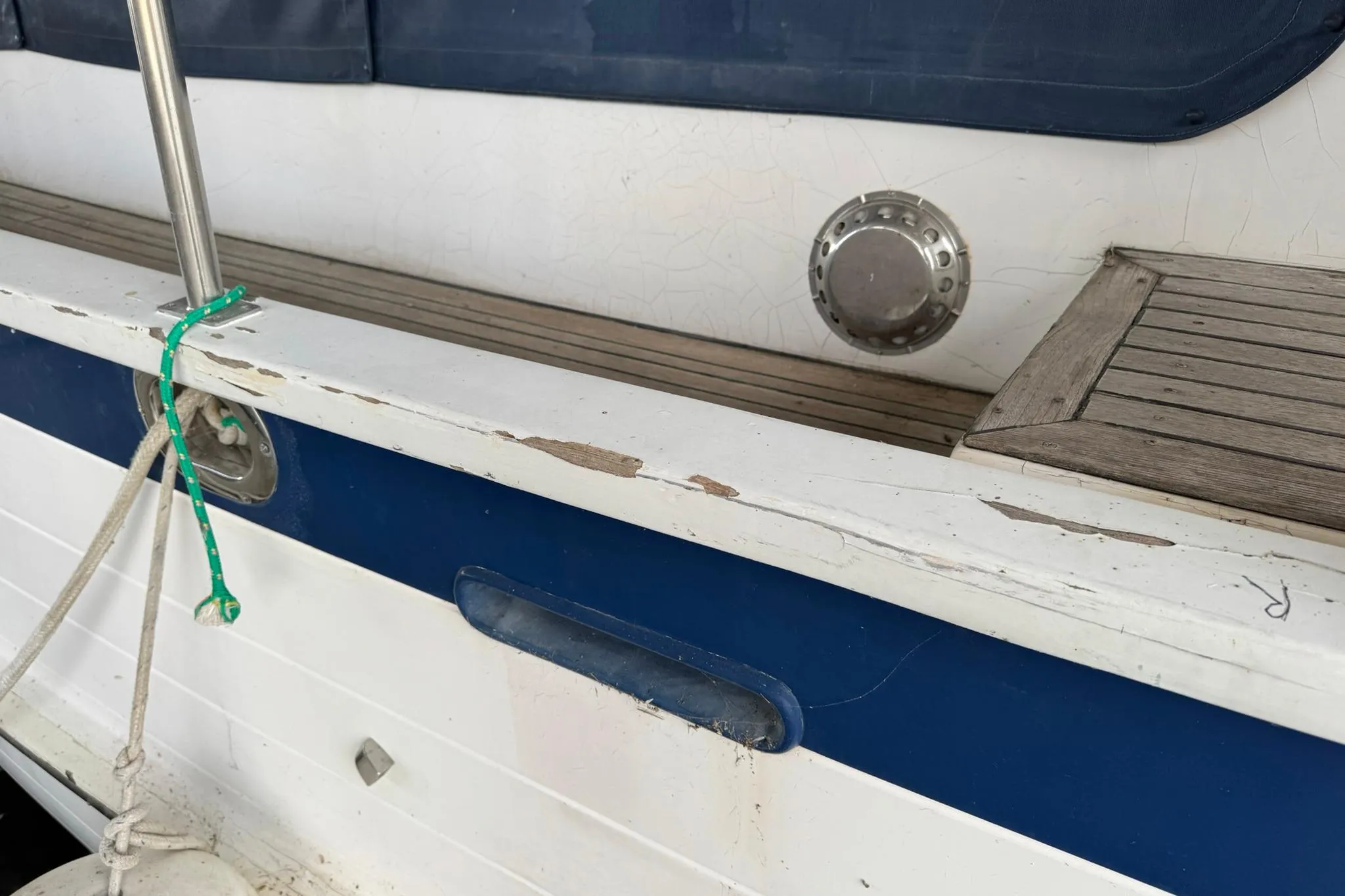 1991 DeFever 44 boat deck with visible wear and wooden details.